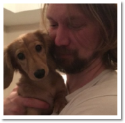 Juniper the English Cream Long Hair Female Miniature Dachshund being loved by the Wiley Family